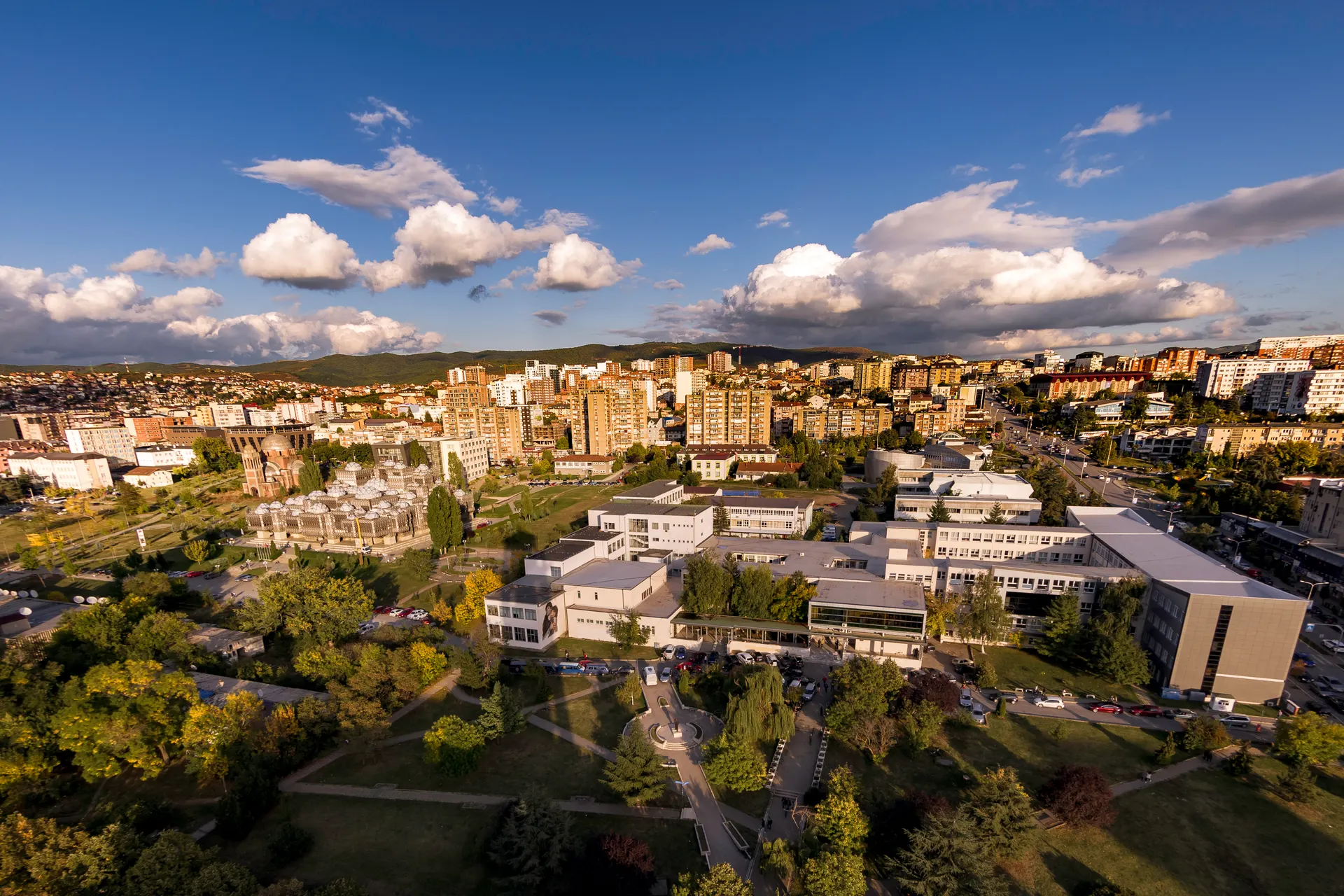 Aerial view over Prishtina under a cloudy sky